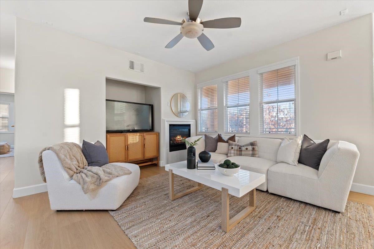 3251 Monaghan Street Dublin, CA 94568 - Photo 20 of 56 a living room with furniture a fireplace and a flat screen tv