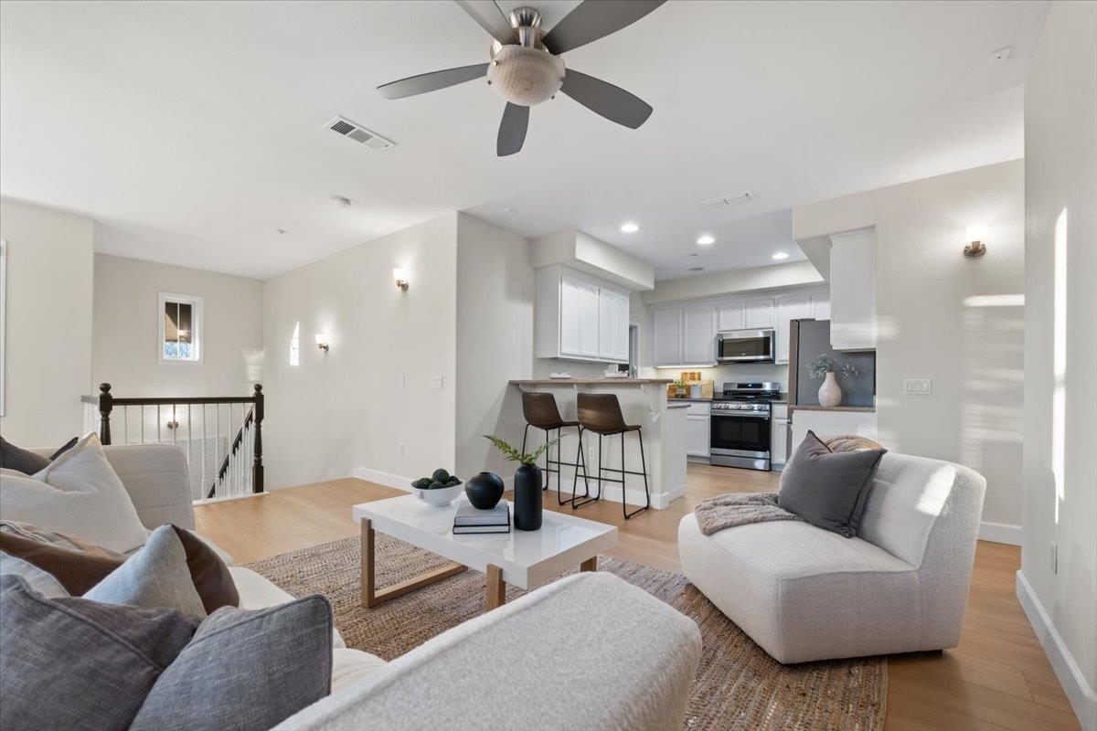 3251 Monaghan Street Dublin, CA 94568 - Photo 23 of 56 a living room with furniture kitchen view and a chandelier