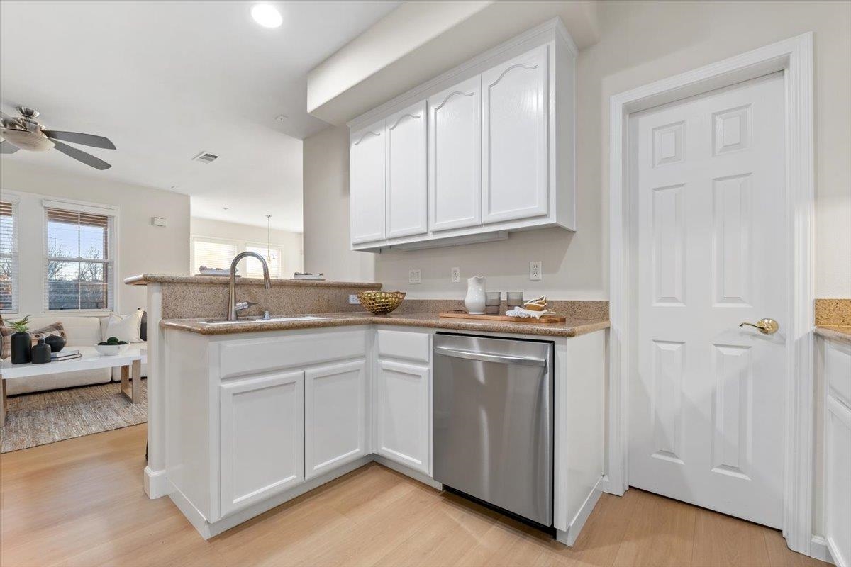 3251 Monaghan Street Dublin, CA 94568 - Photo 30 of 56 a kitchen with granite countertop white cabinets and sink