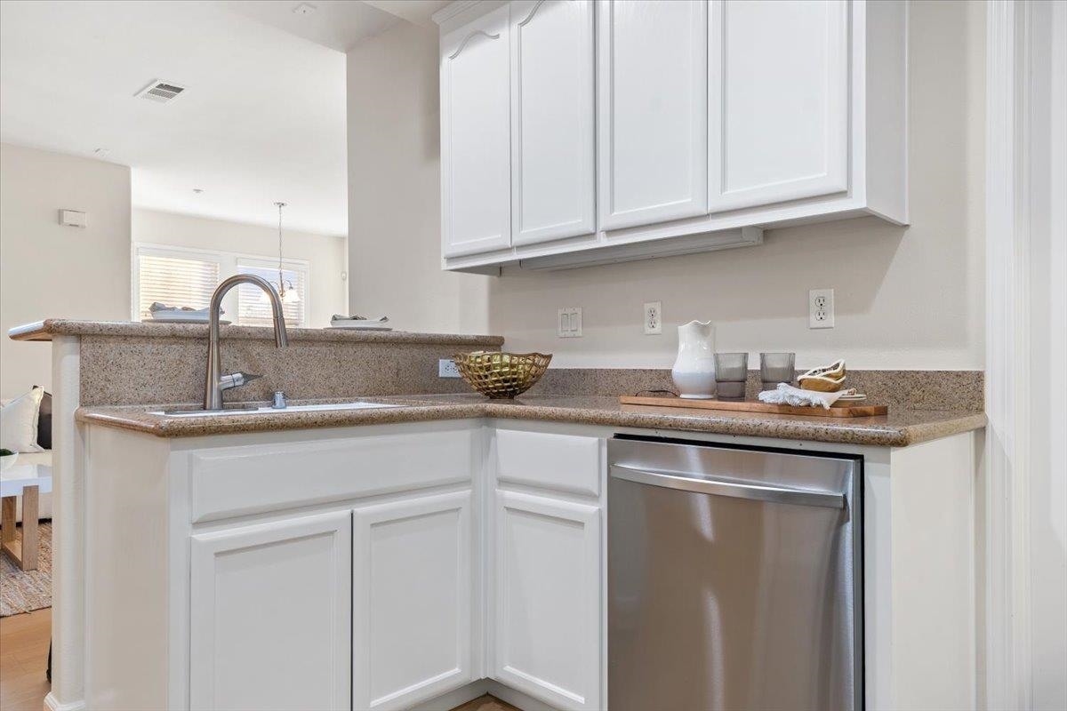 3251 Monaghan Street Dublin, CA 94568 - Photo 31 of 56 a kitchen with stainless steel appliances granite countertop a sink and cabinets