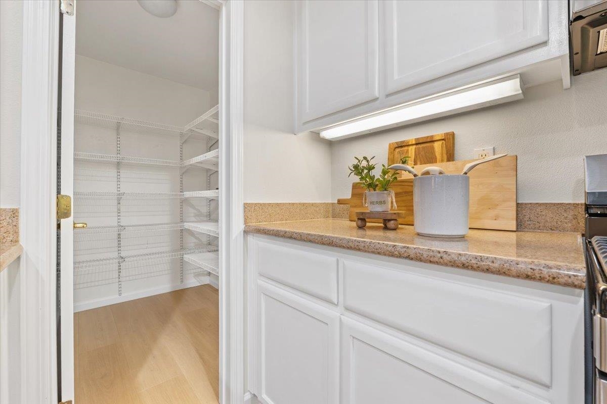 3251 Monaghan Street Dublin, CA 94568 - Photo 32 of 56 a bathroom with a granite countertop sink and a mirror