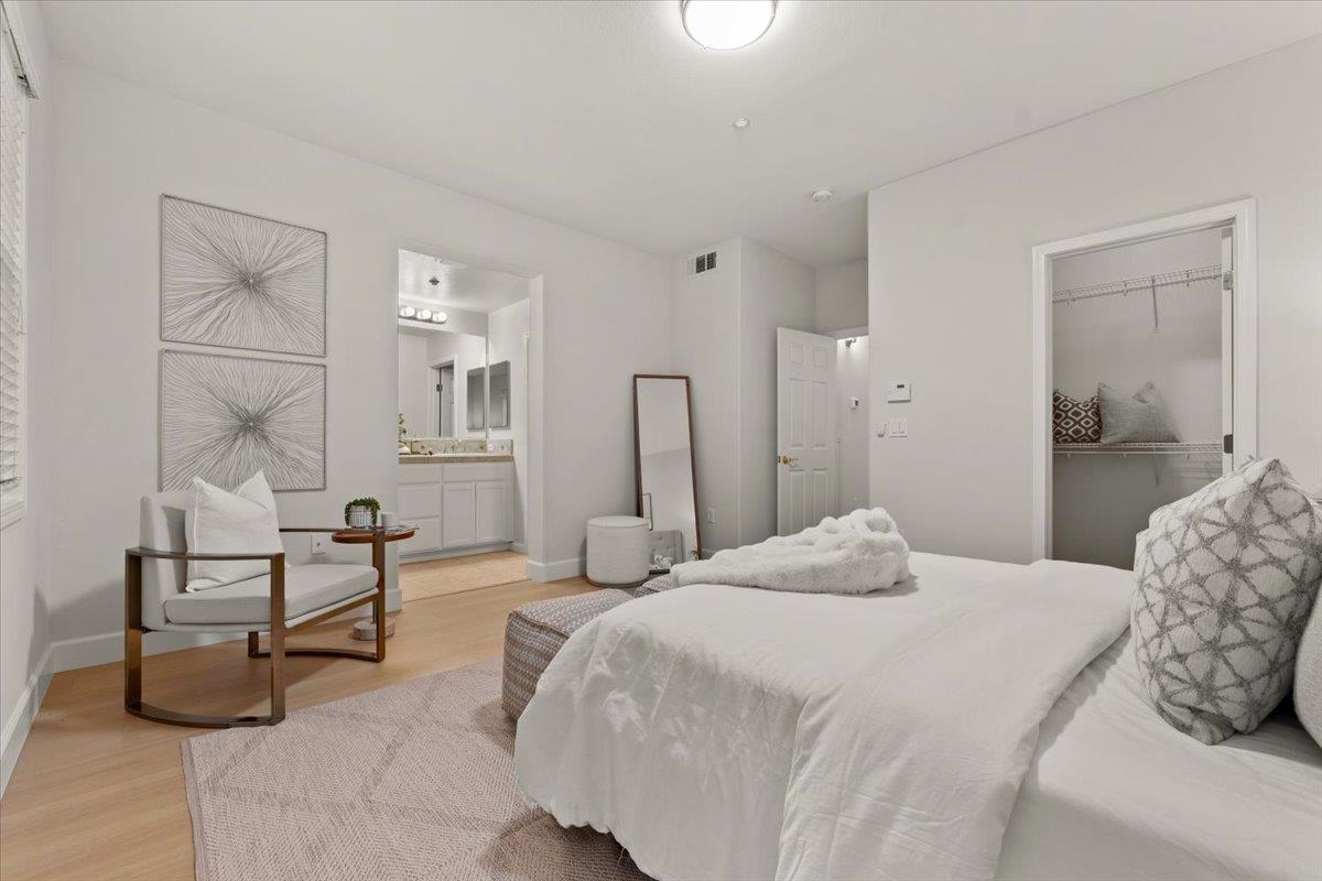 3251 Monaghan Street Dublin, CA 94568 - Photo 43 of 56 a bedroom with a bed and a chandelier