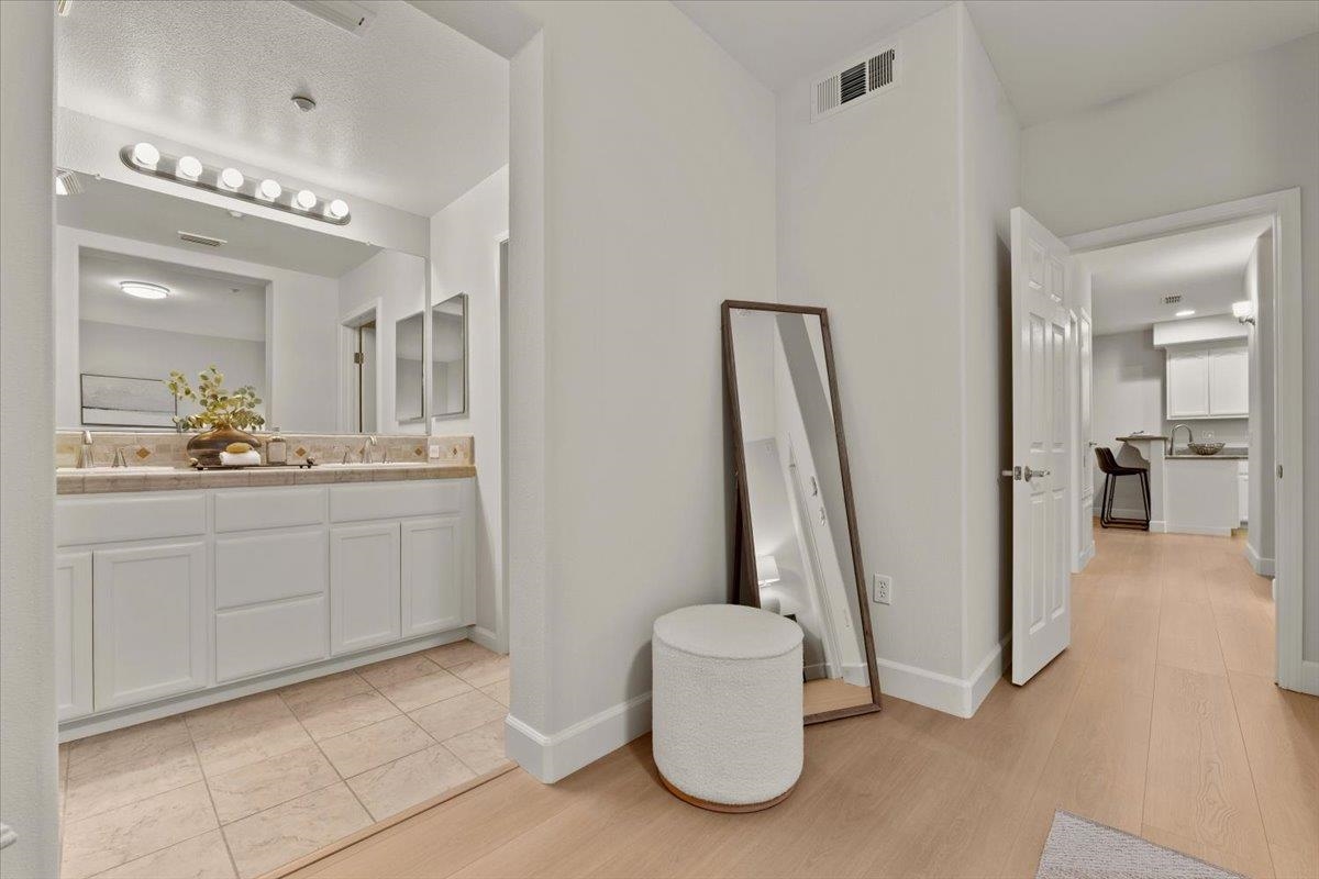 3251 Monaghan Street Dublin, CA 94568 - Photo 48 of 56 a spacious bathroom with a sink and a mirror