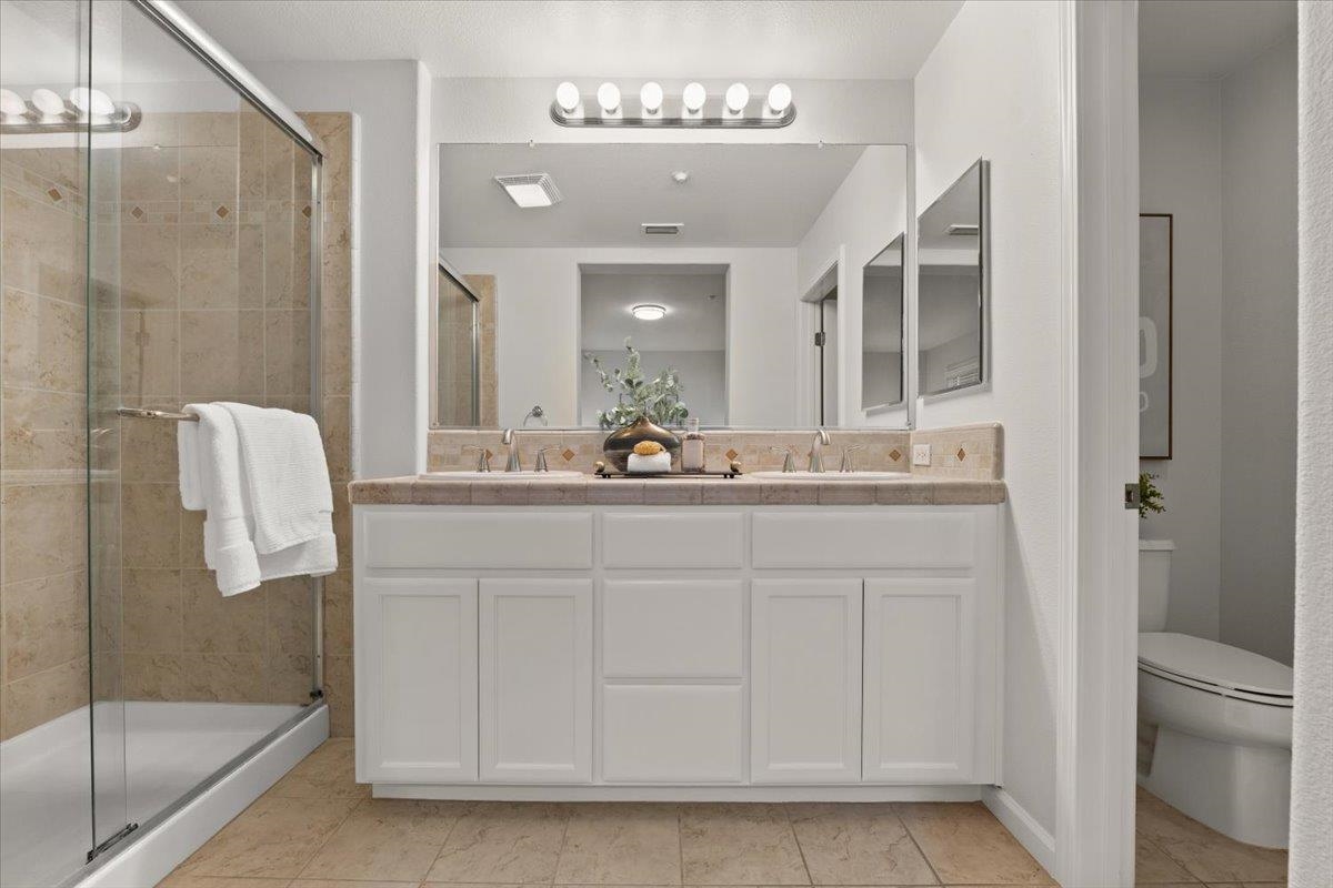 3251 Monaghan Street Dublin, CA 94568 - Photo 49 of 56 a bathroom with a sink a toilet and shower