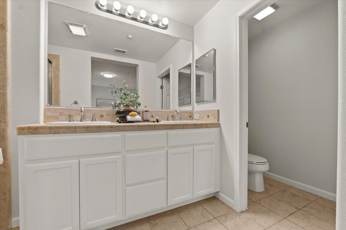 3251 Monaghan Street Dublin, CA 94568 - Photo 50 of 56 a bathroom with a sink and a toilet