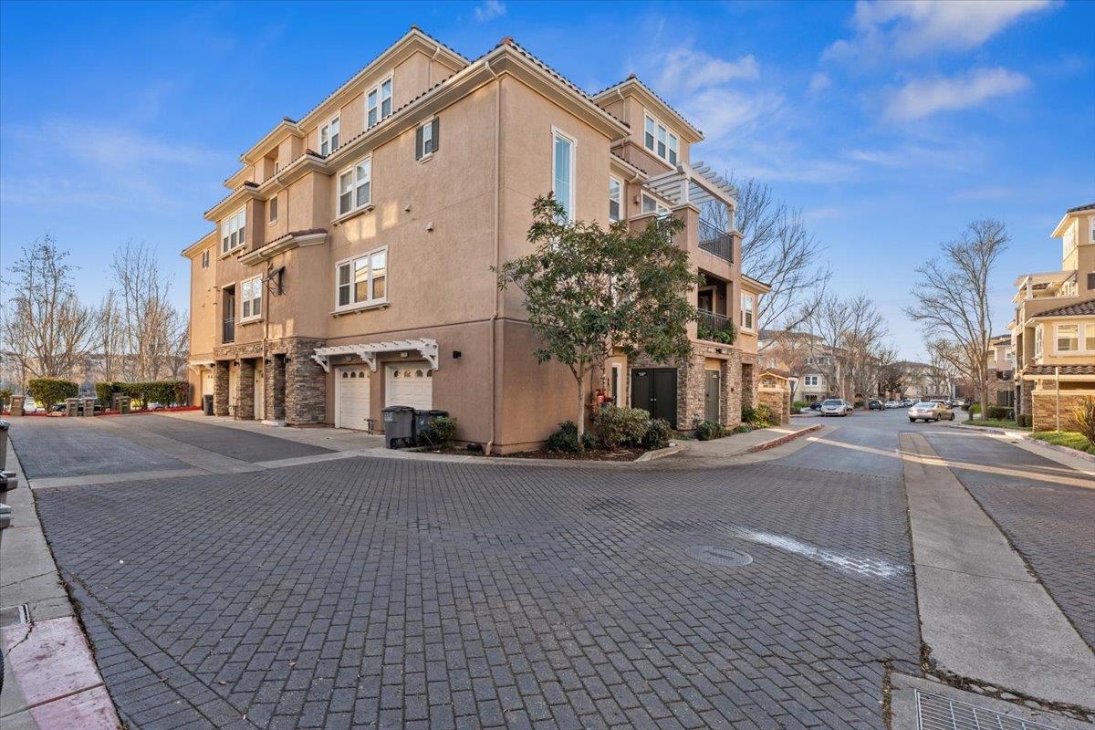 3251 Monaghan Street Dublin, CA 94568 - Photo 52 of 56 a view of a street with a building in the background