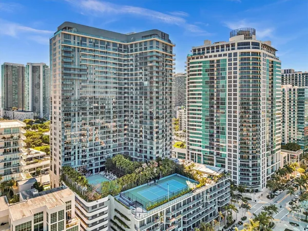 a very nice looking room with a large mirror and a sink