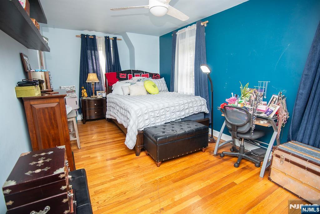 847 Red Road Teaneck, NJ 07666 - Photo 11 of 20 a bedroom with a bed and wooden floor