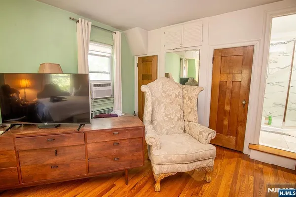 a living room with furniture and flat screen tv