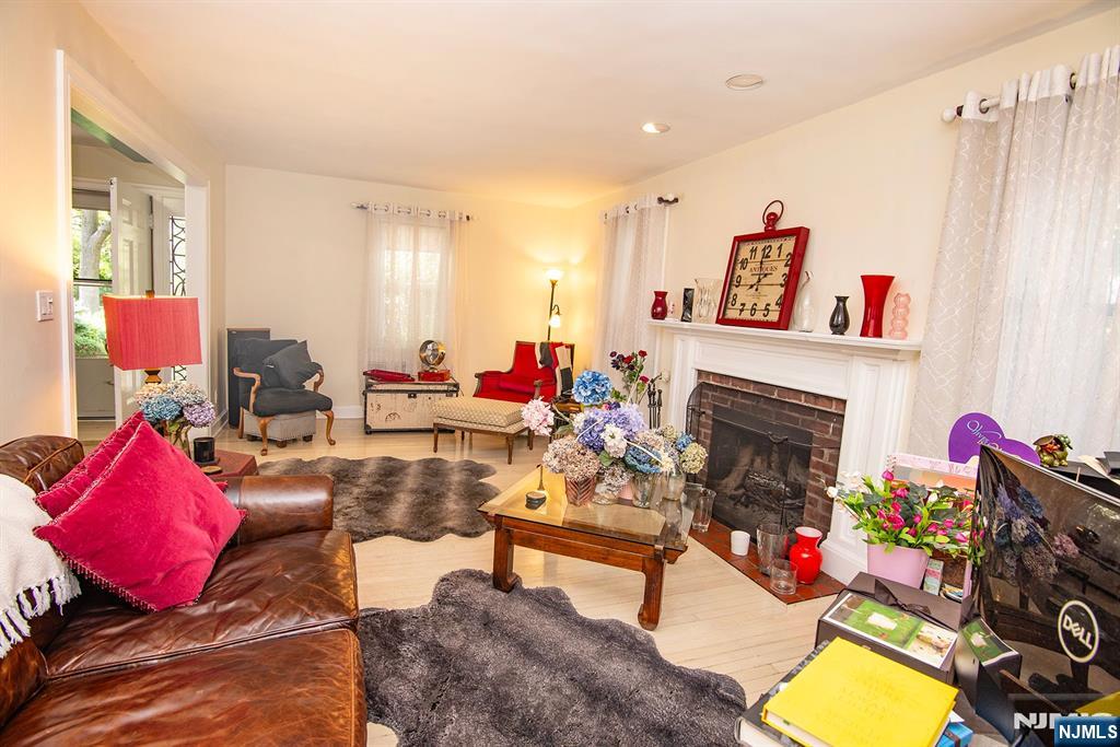 847 Red Road Teaneck, NJ 07666 - Photo 5 of 20 a living room with furniture and a fireplace