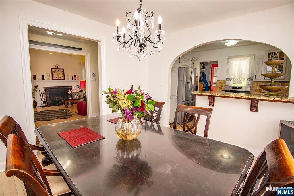 847 Red Road Teaneck, NJ 07666 - Photo 6 of 20 a view of a dining room with furniture and a chandelier