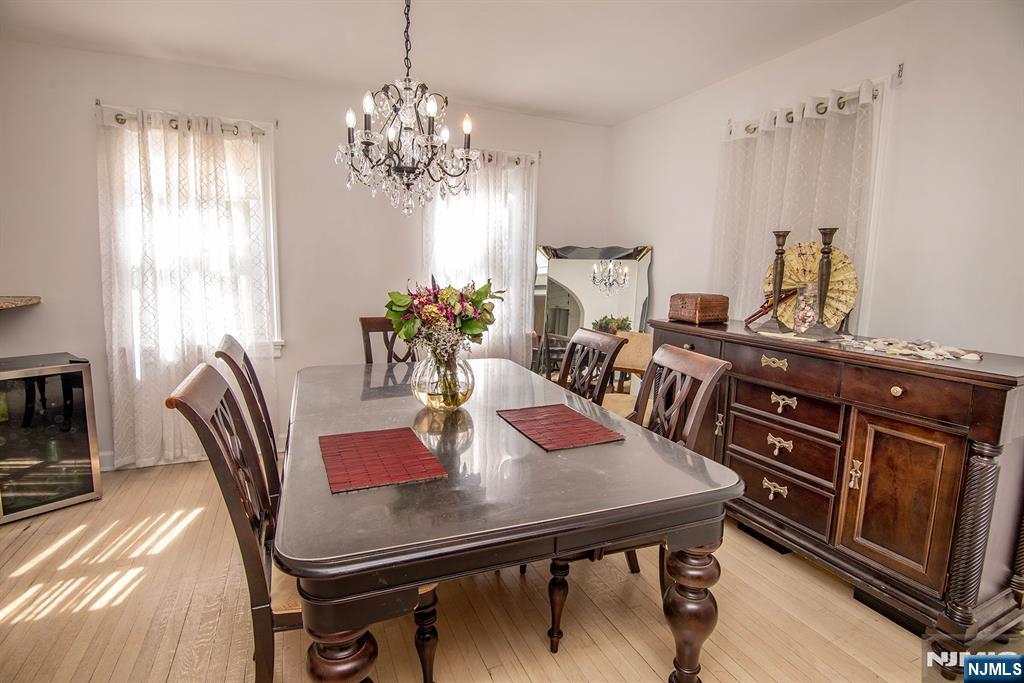 847 Red Road Teaneck, NJ 07666 - Photo 7 of 20 a view of a dining room with furniture and chandelier
