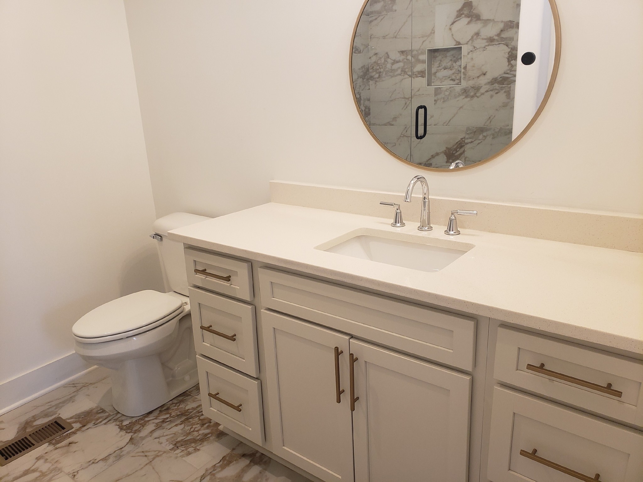 213 Mcauliffe Street Murfreesboro, TN 37130 - Photo 8 of 12 a bathroom with a granite countertop toilet sink mirror and vanity
