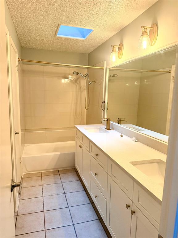 14333 Preston Road, Unit 806 Dallas, TX 75254 - Photo 11 of 17 Dual vanity with integrated sinks, white cabinetry, and a light-toned countertop