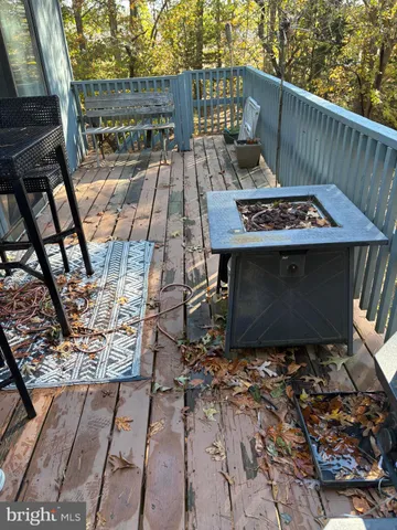 a view of an outdoor sitting area with brick wall