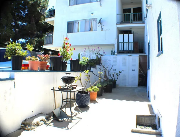 a living room with furniture and flowers