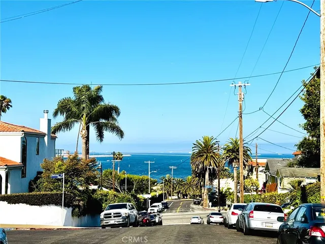 a view of a city street with cars