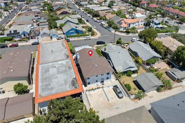 an aerial view of residential houses with outdoor space