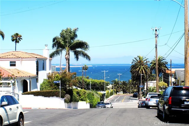 a view of multiple houses with a street