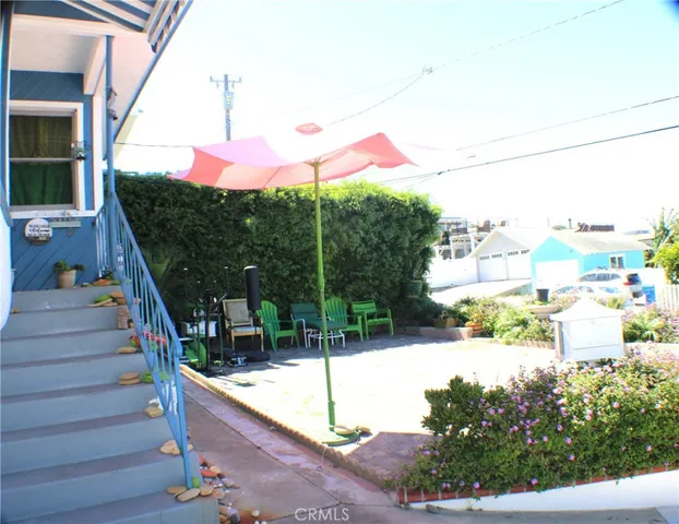 a view of fountain along the path and living room