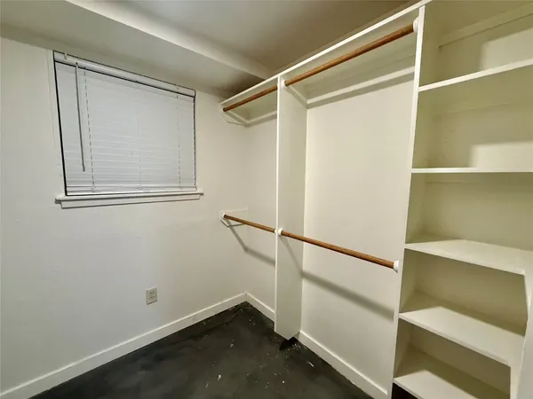 a view of an empty walk in closet