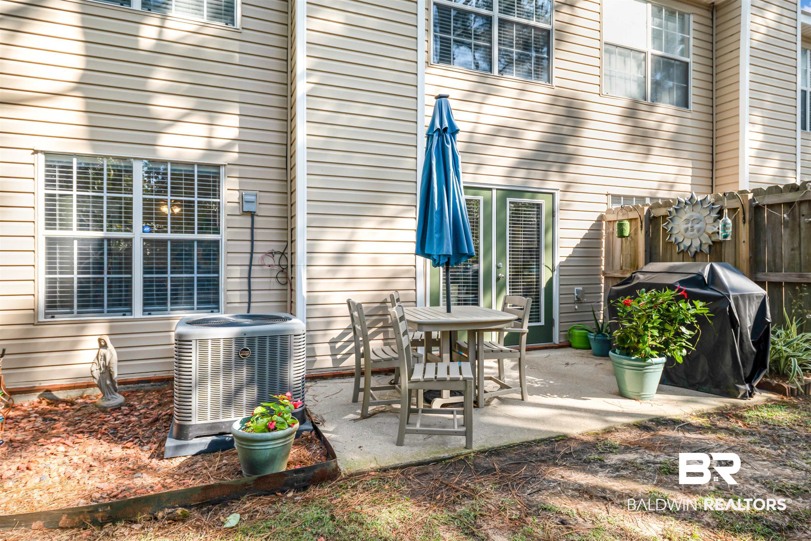 1517 Regency Road, Unit 68 Gulf Shores, AL 36542 - Photo 29 of 43 View of patio featuring area for grilling and central AC unit