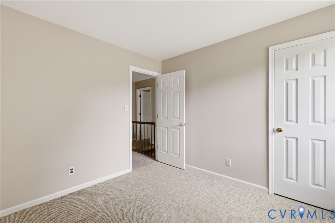 4548 Ridgecrest Lane Colonial Heights, VA 23834 - Photo 30 of 34 Carpeted bedroom with spacious closet