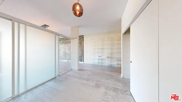 a view of an entryway with wooden floor