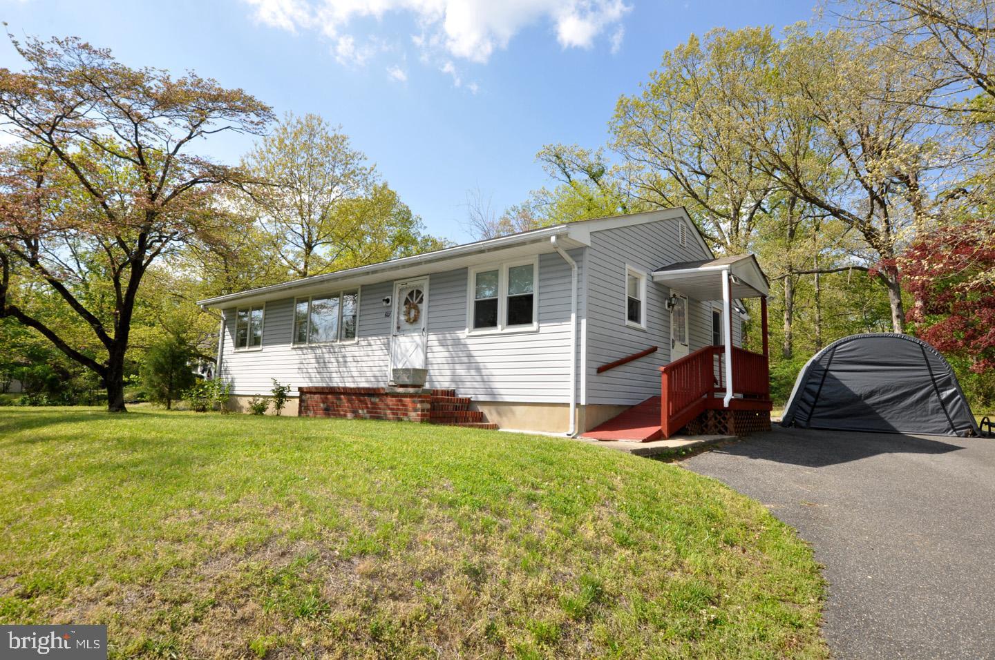 607 North Broad Street Hainesport, NJ 08036 - Photo 2 of 24 a view of a house with a yard porch and sitting area