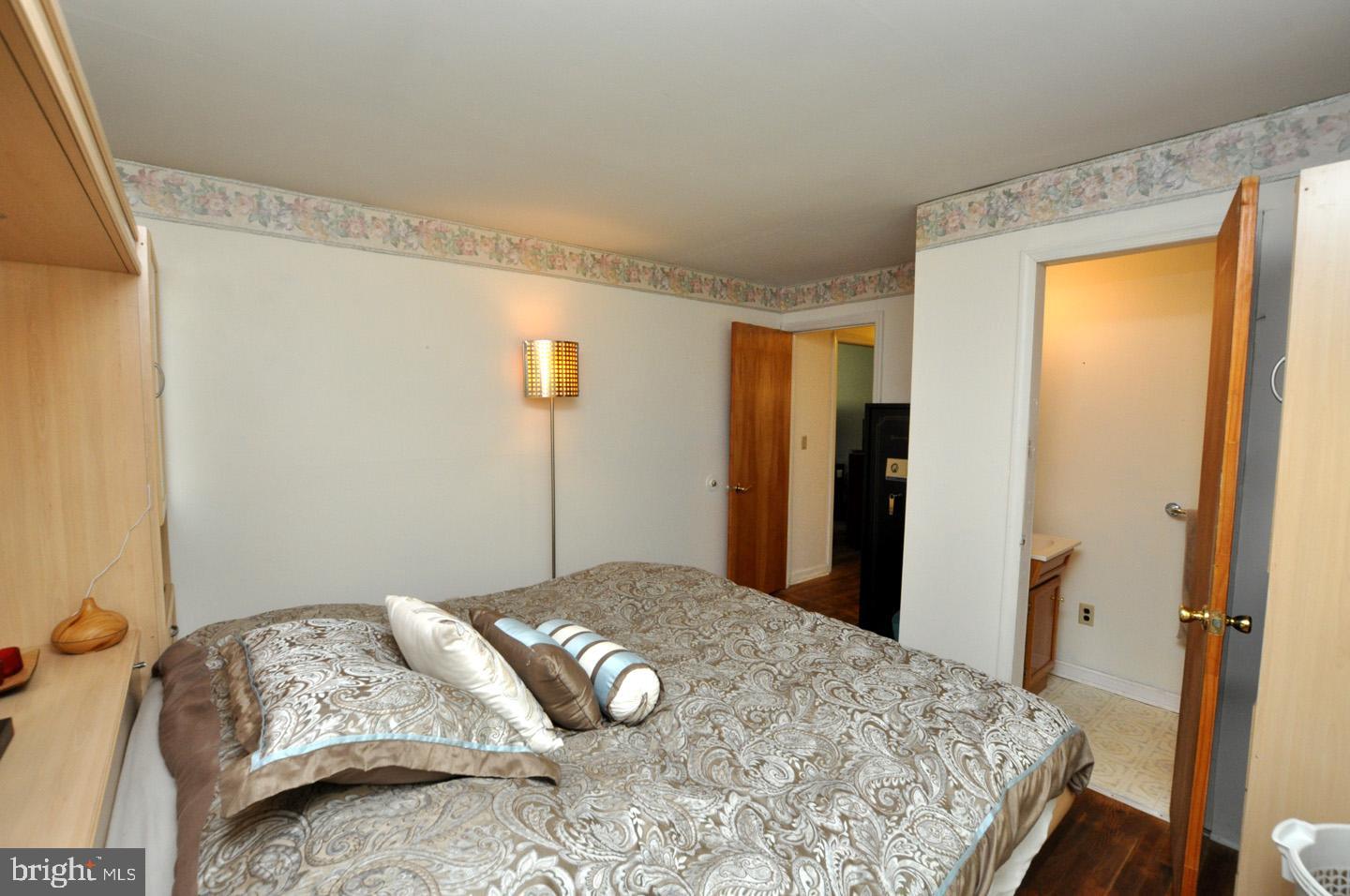 607 North Broad Street Hainesport, NJ 08036 - Photo 11 of 24 a bedroom with a bed and a mirror