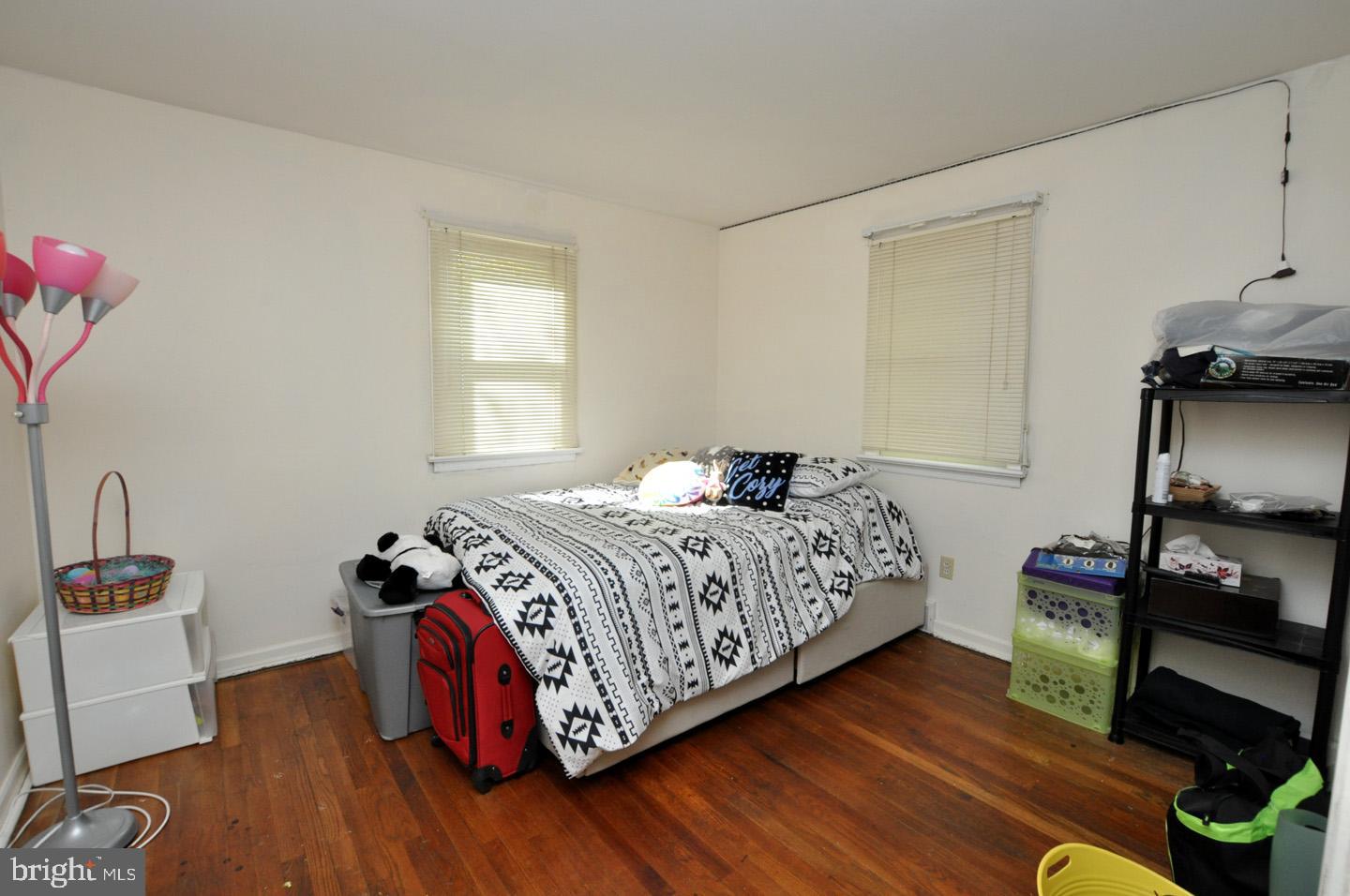 607 North Broad Street Hainesport, NJ 08036 - Photo 13 of 24 a bedroom with a bed and wooden floor