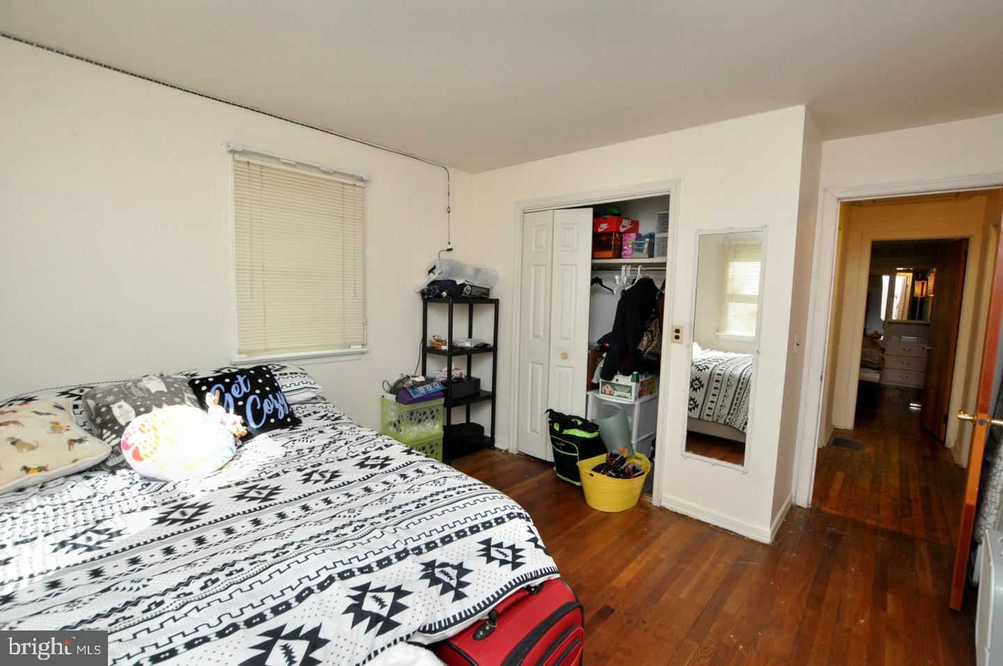607 North Broad Street Hainesport, NJ 08036 - Photo 14 of 24 a bedroom with a bed and a walk in closet