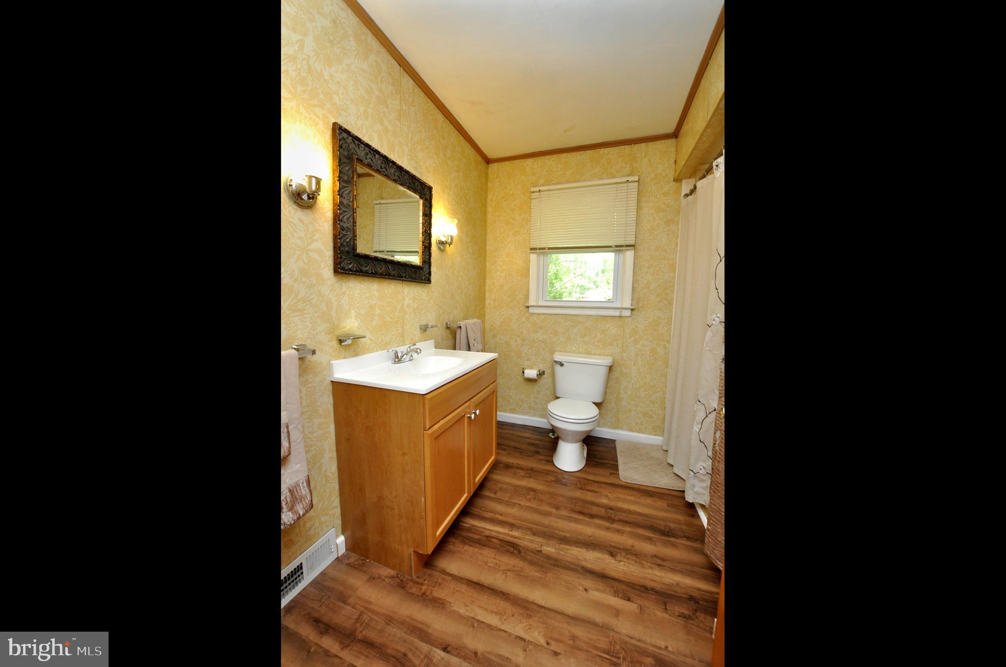 607 North Broad Street Hainesport, NJ 08036 - Photo 16 of 24 a spacious bathroom with a sink and mirror