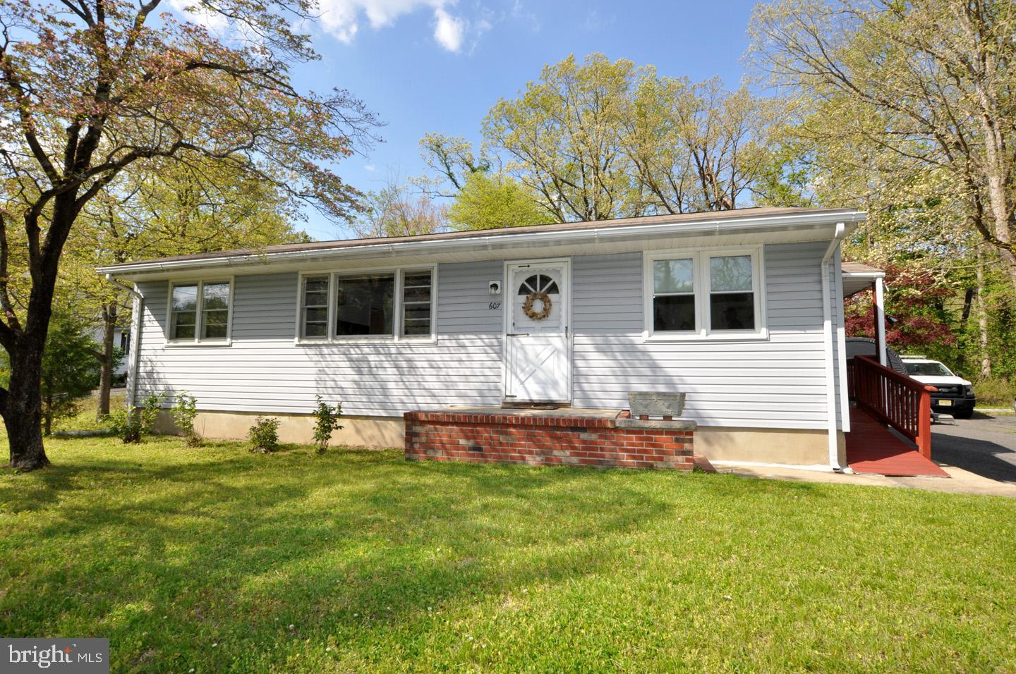 607 North Broad Street Hainesport, NJ 08036 - Photo 3 of 24 a front view of house with yard and green space