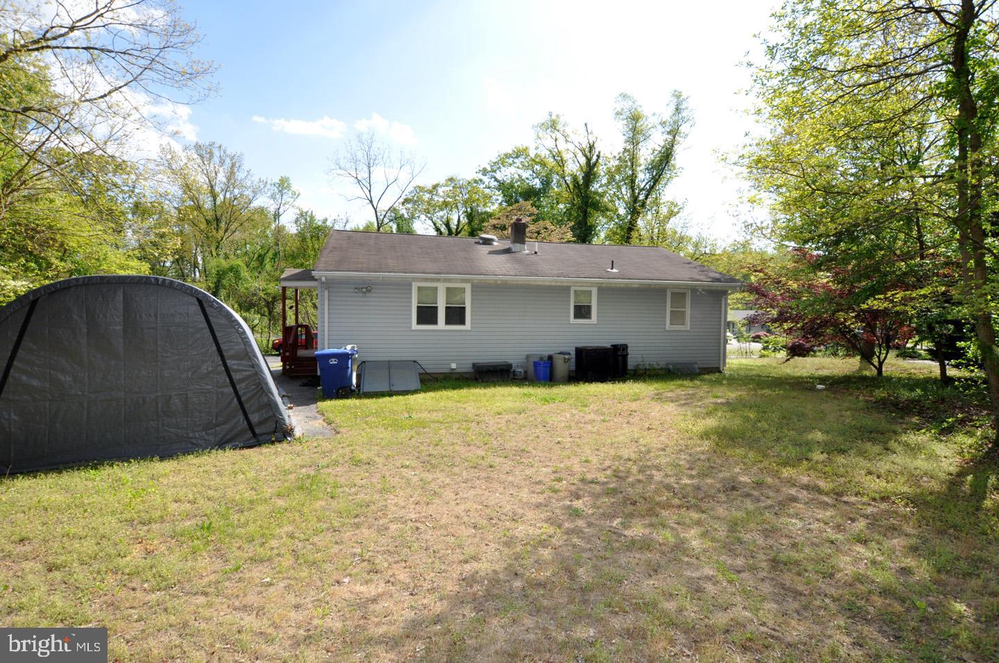 607 North Broad Street Hainesport, NJ 08036 - Photo 23 of 24 a view of a house with a yard and garage