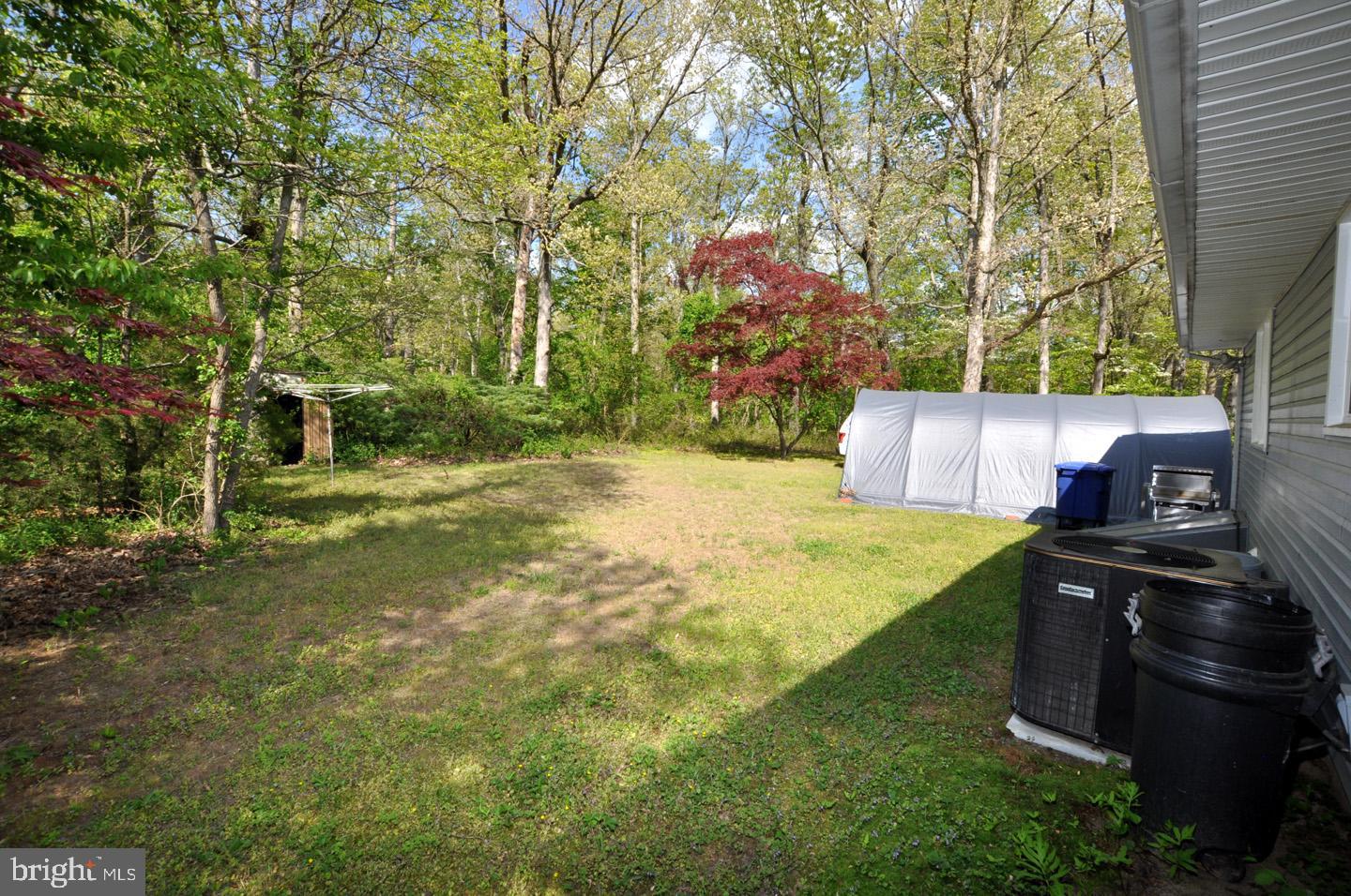 607 North Broad Street Hainesport, NJ 08036 - Photo 24 of 24 a backyard of a house with lots of green space