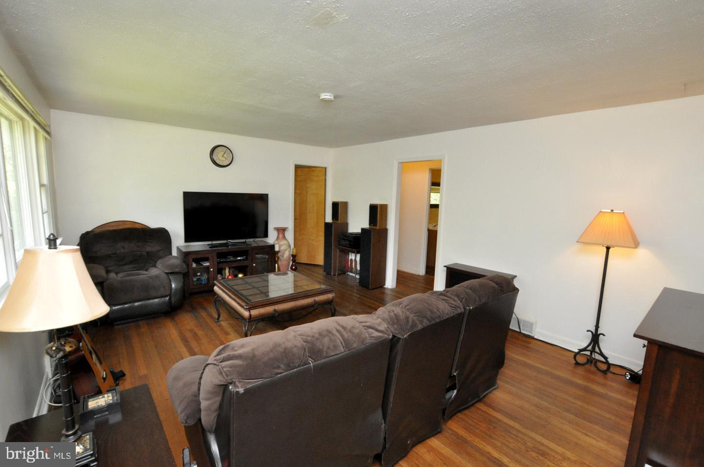 607 North Broad Street Hainesport, NJ 08036 - Photo 7 of 24 a living room with furniture and a flat screen tv