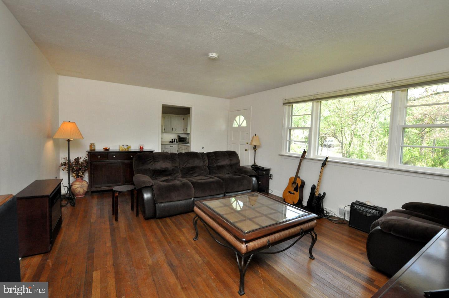 607 North Broad Street Hainesport, NJ 08036 - Photo 8 of 24 a living room with furniture and a wooden floor