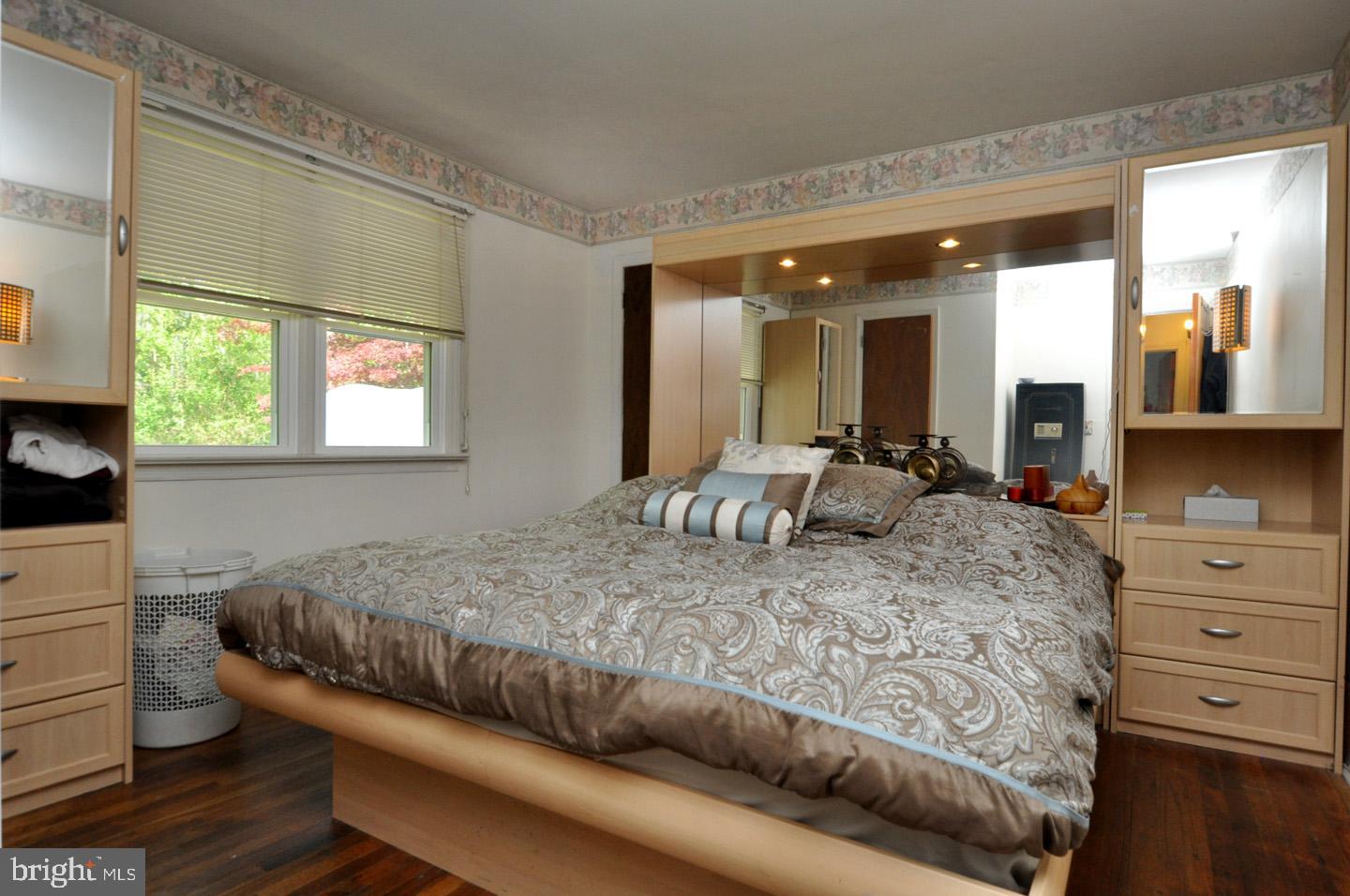 607 North Broad Street Hainesport, NJ 08036 - Photo 10 of 24 a living room with a bed and dresser