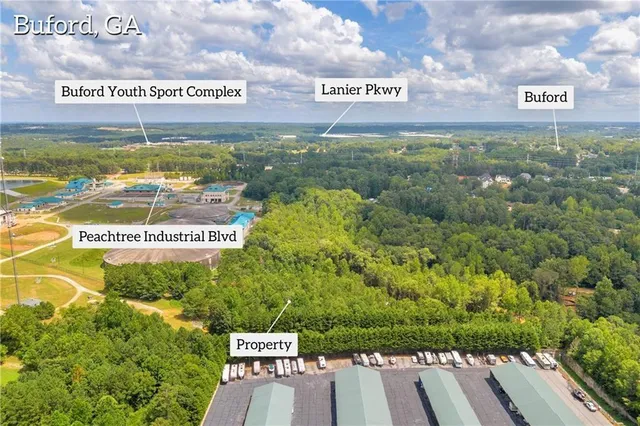 a bathroom with a swimming pool and trees in the background
