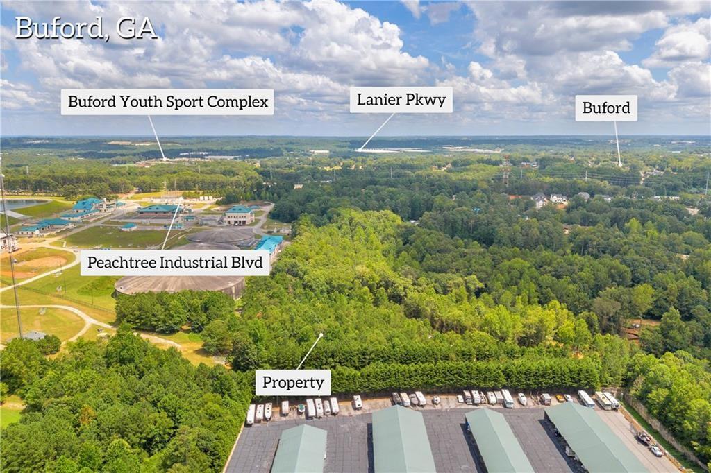 5561 Shadburn Ferry Road Buford, GA 30518 - Photo 11 of 15 a sign that is on the side of a building