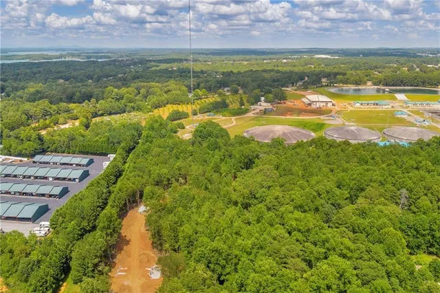 a view of a lake view with houses in the background