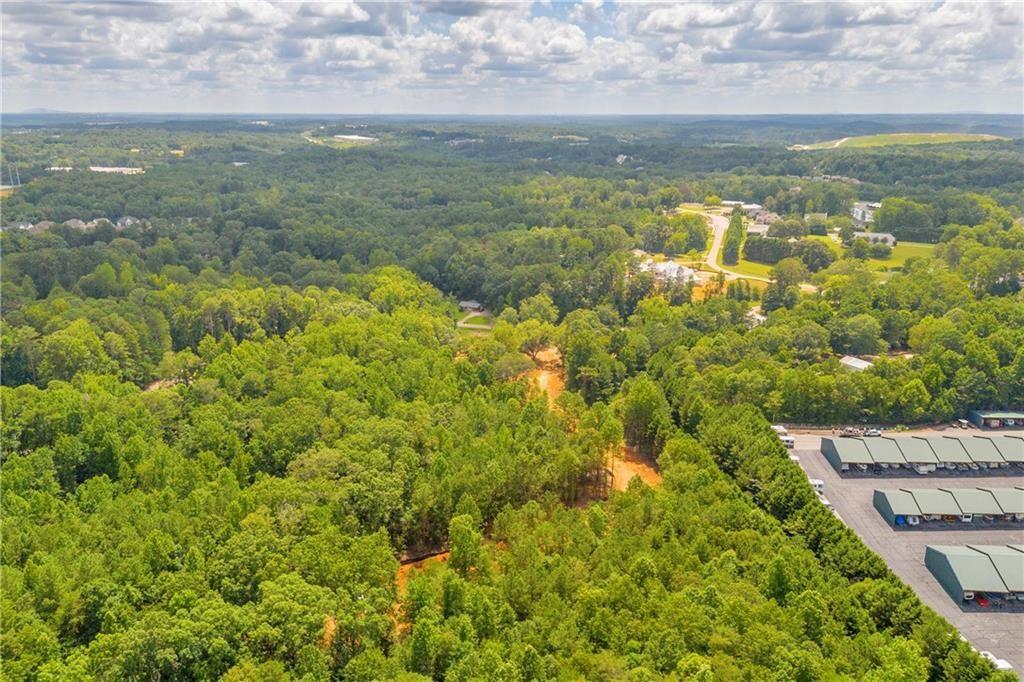 5561 Shadburn Ferry Road Buford, GA 30518 - Photo 8 of 15 a view of a lake view with houses in the background