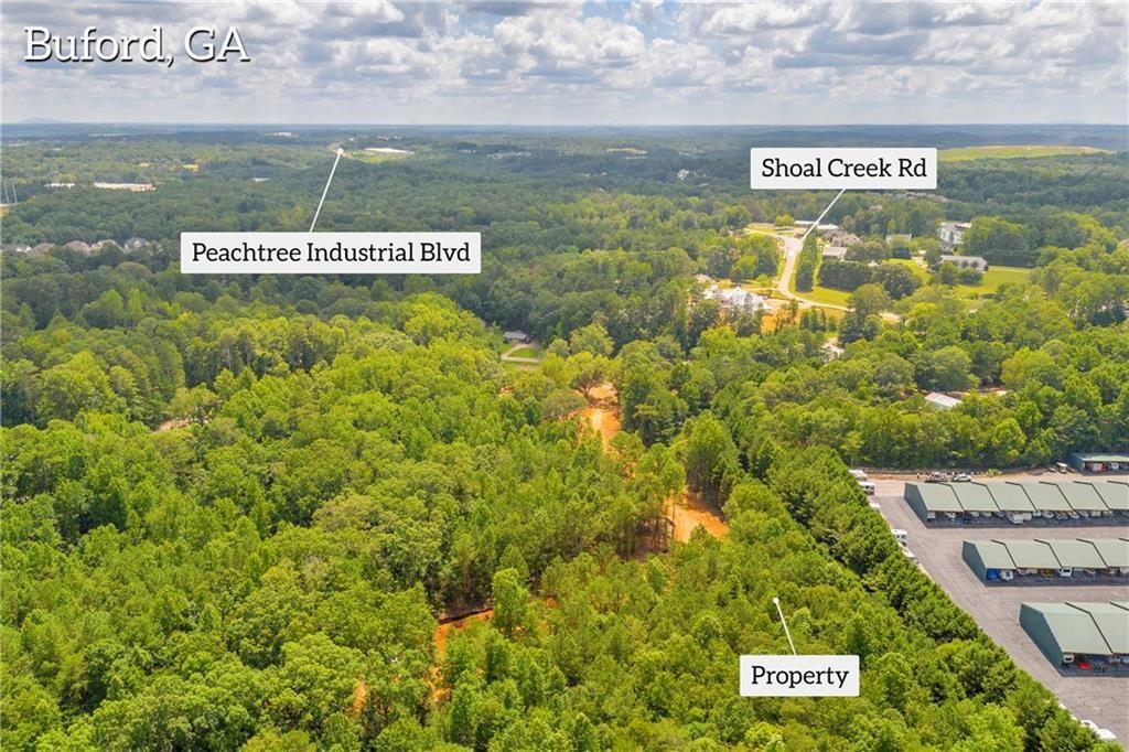 5561 Shadburn Ferry Road Buford, GA 30518 - Photo 9 of 15 a sign broad in the middle of a lake