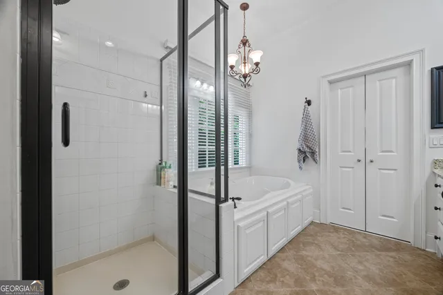 a view of a storage and utility room with washer and dryer