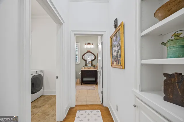a bedroom with furniture and a chandelier