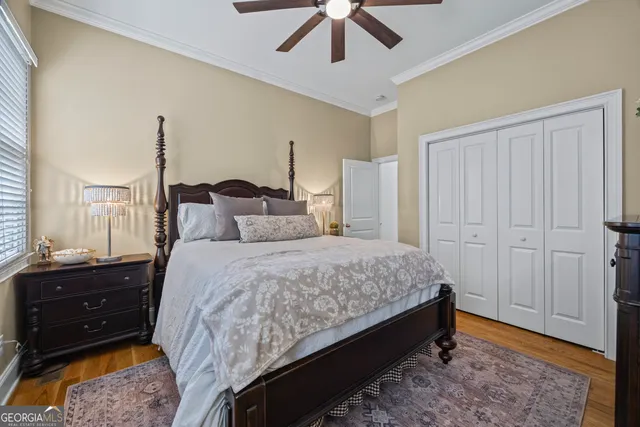 a bedroom with furniture and a chandelier
