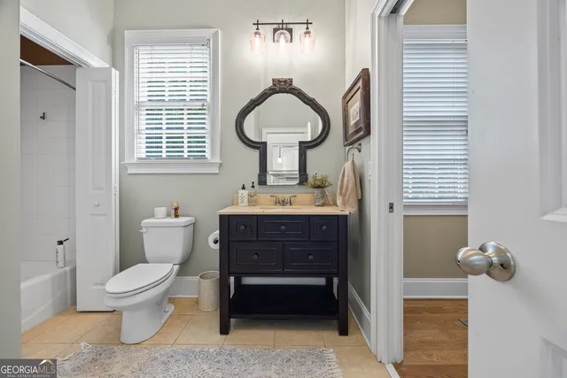 a bedroom with a bed and a view of bedroom