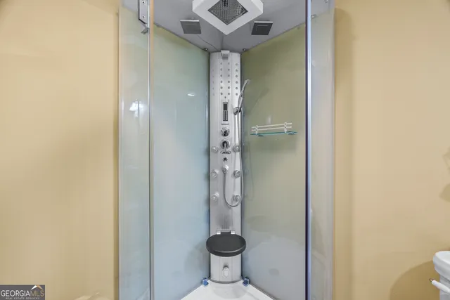 an aerial view of residential houses with outdoor space and trees