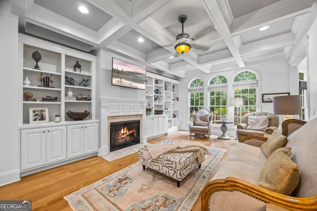a kitchen with granite countertop a stove sink and microwave